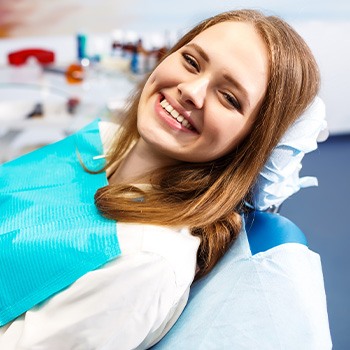 a dental patient smiling before her root canal