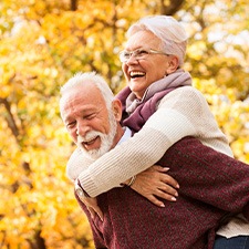 a senior couple smiling and laughing