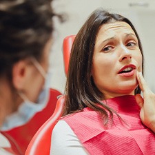 a patient dealing with dental pain