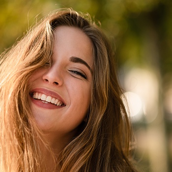 Woman smiling outside