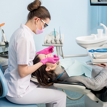 Dental hygienist performing a dental cleaning