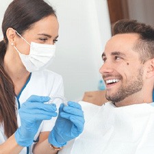 an Invisalign patient visiting his patient for a checkup