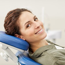 a patient smiling after undergoing gum disease treatment