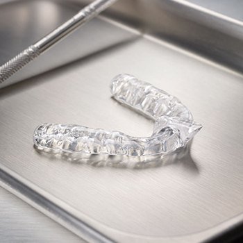 Clear nightguard for bruxism to prevent teeth grinding and clenching on metal tray