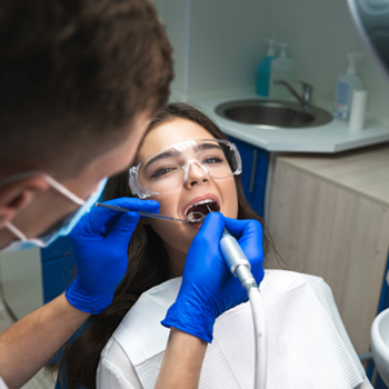 Woman in dental chair undergoing root canal