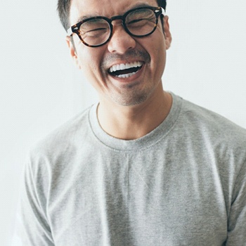 person with porcelain veneers laughing.